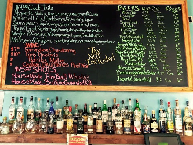 A chalkboard displaying a variety of drinks available at The Montecristo Apartments, located in the desirable Stone Oak neighborhood of San Antonio.